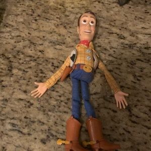 This is a very rare woody doll called fire fightin woody made by Hasbro.